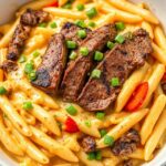 Creamy Cajun Steak & Cheddar Penne Skillet Recipe